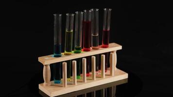 Test tubes with colored liquids in wooden holder video