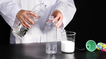 Scientist prepares materials for balloon inflation experiment video