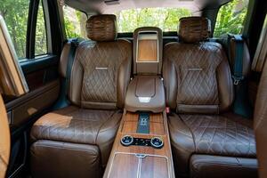 The Luxurious Leather Interior of a HighEnd SUV offers an unparalleled level of comfort, making every journey an extraordinary and enjoyable experience that you wont soon forget photo
