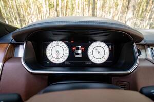 The luxury car dashboard boasts a sleek, modern design complemented by advanced features that enhance both its functionality and aesthetic appeal, providing an enjoyable driving experience photo