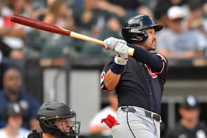 Cleveland Guardians left fielder Steven Kwan (38) hits a sacrifice RBI during the seventh inning against the Chicago White Sox at Rate Field. editorial_image