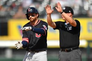 Cleveland Guardians second baseman Daniel Schneemann (10) reacts after hitting his double during the fourth inning against the Chicago White Sox at Rate Field. editorial_image