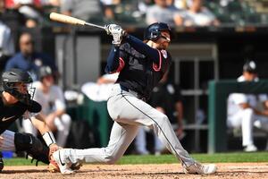 Cleveland Guardians second baseman Daniel Schneemann (10) hits a double during the fourth inning against the Chicago White Sox at Rate Field. editorial_image