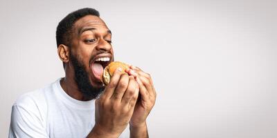 Man enjoying a hamburger photo