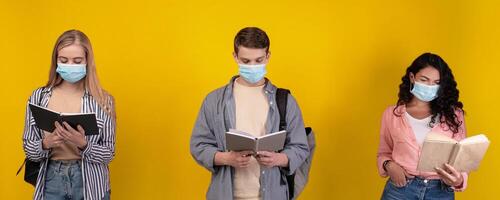 Students reading books with face masks photo