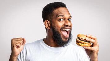 Man enjoying a hamburger photo