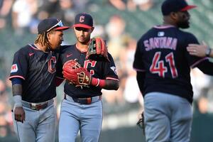 Cleveland Guardians third baseman Jose Ramirez (11) and shortstop Brayan Rocchio (4) celebrate after defeating the Chicago White Sox at Rate Field. editorial_image