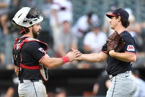 Cleveland Guardians catcher Austin Hedges (27) and pitcher Matt Festa (52) celebrate after defeating the Chicago White Sox at Rate Field. editorial_image