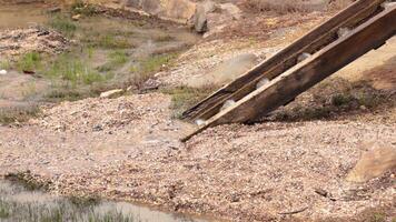 Water flows through a historic mining site video
