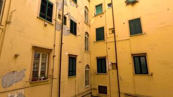 Yellow building with green shutters and windows video