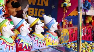Clown heads bobbing at a carnival booth game video