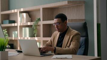 Business man African American writer pensive entrepreneur working laptop in office think consider ponder thoughts creative male businessman come up with idea typing project on computer happy insight video