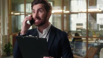Angry man business employer annoyed businessman guy talking mobile phone in office male director entrepreneur middle-aged irritated mad quarrel arguing call negative conversation problem dissatisfied video