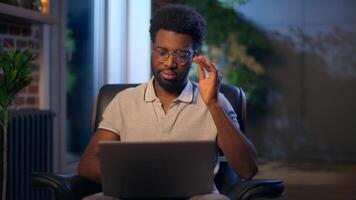 African American business man tired guy in night office headache suffer businessman exhausted employee architect online evening work sick male feel pain ache migraine stress overwork problem health video