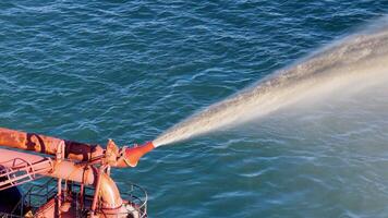 A dredging machine pumps sand into the ocean, combating erosion under clear skies on the Gold Coast video