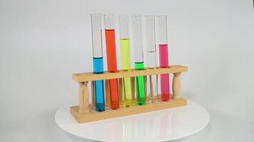 Test tubes with colored liquids in a rack video