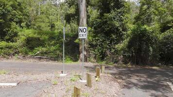 Sign indicating no exit near wooded area video