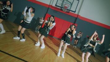 Dancers Performing Choreographed Routine in Gymnasium video
