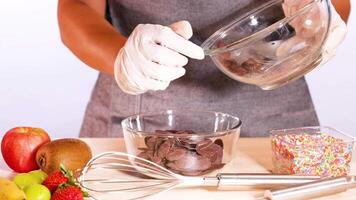 Preparing chocolate discs with fresh fruits and sprinkles video