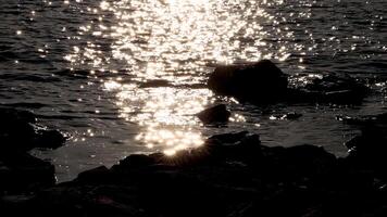 Evening sunlight reflecting on sea at Brighton Beach video