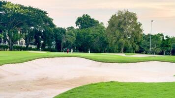 Serene golf course with lush greenery and sand traps video