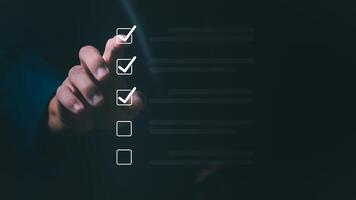 a Businessmen mark check blocks to verify the correctness and approve or accept the agreement. in digital documents Concept of working via the internet photo