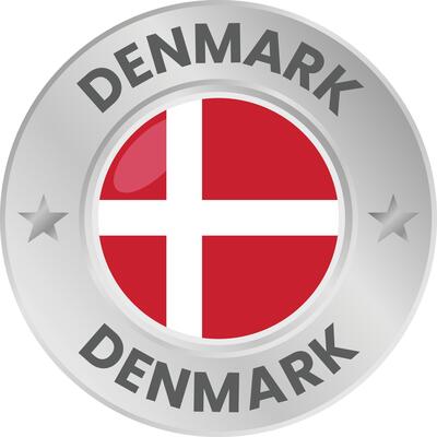 Denmark flag in silver colored medal. National flag in metal circle emblem.