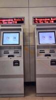 Two ticket vending machines in a metro station photo