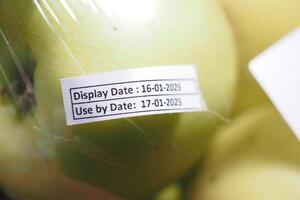 Fresh fruit packaging with display and use by dates photo