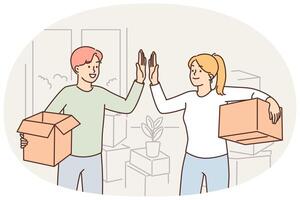 Couple celebrating while moving boxes vector