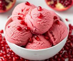 Bowl of pomegranate ice cream with seeds photo