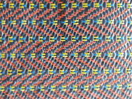A close up of a fabric with colorful squares photo