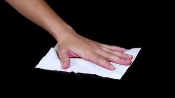 A hand cleans a surface using a cloth video