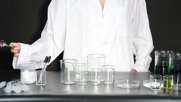 Scientist conducting experiment with various lab equipment video
