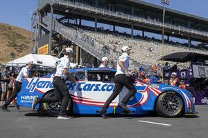 Crew members for NASCAR Cup Series driver Kyle Larson (not pictured) pushes the vehicle onto pit row at Sonoma Raceway. editorial_image