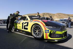 Crew members for NASCAR Cup Series driver Ryan Blaney (not pictured) pushes the vehicle onto pit row at Sonoma Raceway. editorial_image
