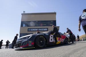 Crew members for NASCAR Cup Series driver Shane van Gisbergen (not pictured) pushes the vehicle onto pit row at Sonoma Raceway. editorial_image