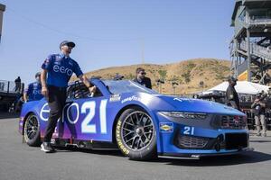 Crew members for NASCAR Cup Series driver Josh Berry (not pictured) pushes the vehicle onto pit row at Sonoma Raceway. editorial_image