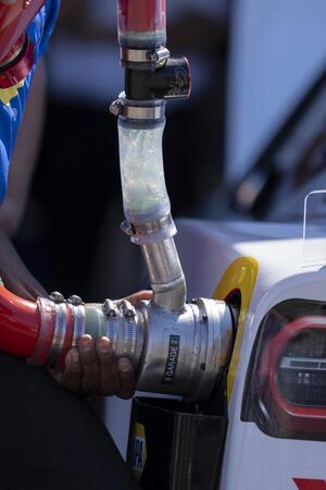 Crew member for NASCAR Cup Series driver Chase Elliott (not pictured) refuels the vehicle before the race at Sonoma Raceway. editorial_image