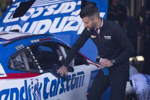 Crew member for NASCAR Cup Series driver Kyle Larson (not pictured) wipes the vehicle before the race at Sonoma Raceway. editorial_image