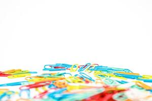 Colorful Array of Paper Clips Isolated on White Background for Office or School Supplies photo