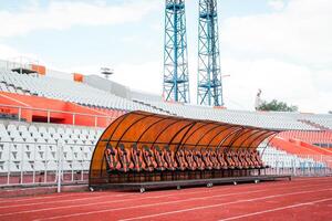 a team section at a football stadium. Karaganda multifunctional sports stadium,. Ideal for use in articles about sports infrastructure, urban development, or event planning photo