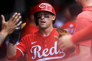 Cincinnati Reds outfielder TJ Friedl (29) high fives teammates after scoring on a single hit by outfielder Austin Hays (not pictured) in the third inning against the Colorado Rockies at Great American Ball Park. editorial_image