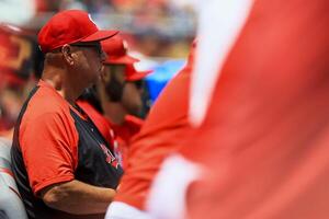 Cincinnati Reds manager Terry Francona (77) sits in the dugout during the second inning against the Colorado Rockies at Great American Ball Park. editorial_image