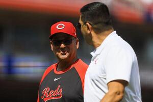 Cincinnati Reds manager Terry Francona (77) walks off the field during a stop in play in the eighth inning against the Colorado Rockies at Great American Ball Park. editorial_image