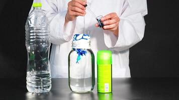 A scientist demonstrates a chemical reaction using dye, shaving cream, and liquids in a laboratory setting video