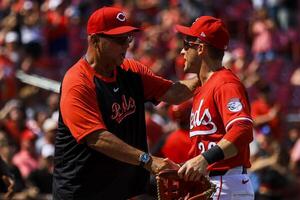 Cincinnati Reds manager Terry Francona (77) shakes hands with outfielder TJ Friedl (29) after the victory over the Colorado Rockies at Great American Ball Park. editorial_image