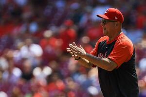 Cincinnati Reds manager Terry Francona (77) walks on the field during a pitching change in the sixth inning against the Colorado Rockies at Great American Ball Park. editorial_image