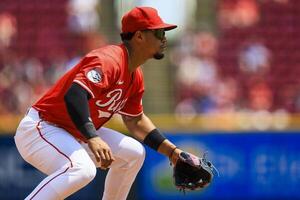 Cincinnati Reds third baseman Santiago Espinal (4) prepares for the pitch in the sixth inning against the Colorado Rockies at Great American Ball Park. editorial_image