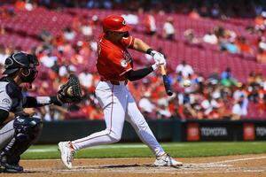 Cincinnati Reds first baseman Spencer Steer (7) hits a RBI single in the seventh inning against the Colorado Rockies at Great American Ball Park. editorial_image